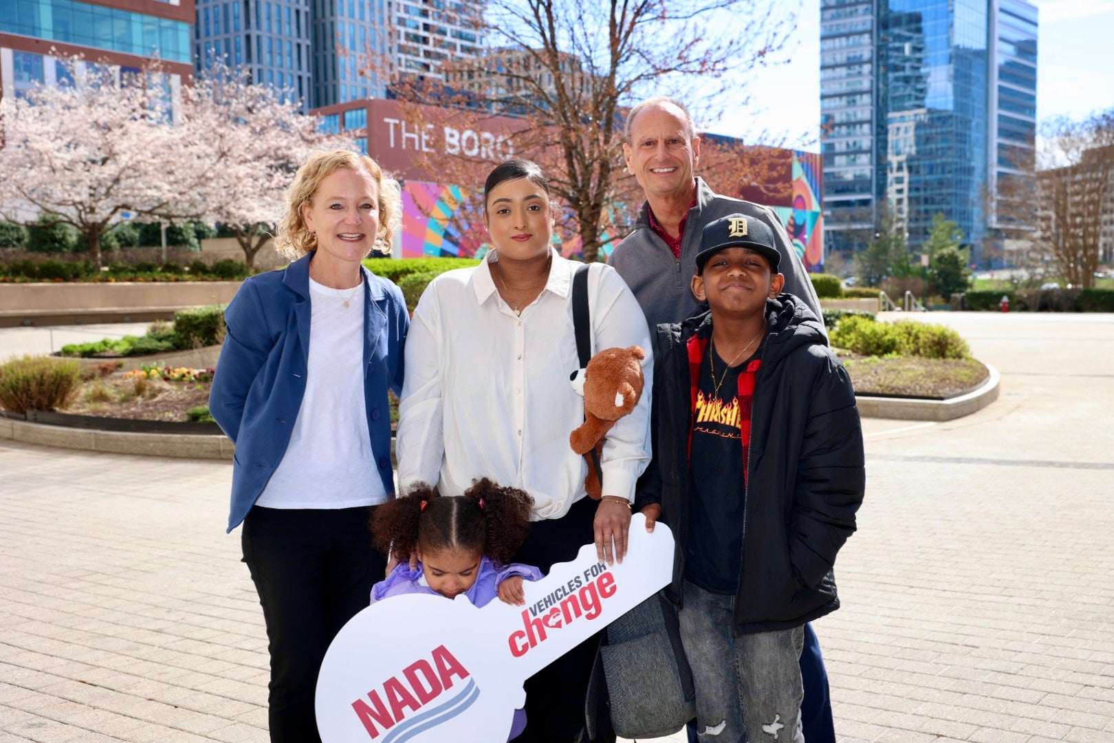 five people posing for photo