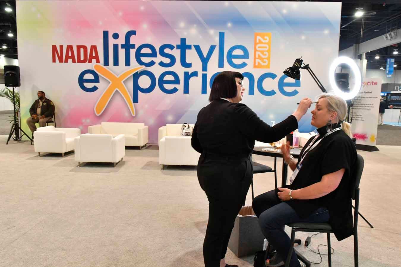 A lady receives a makeover during the Lifestyle Experience at NADA Show