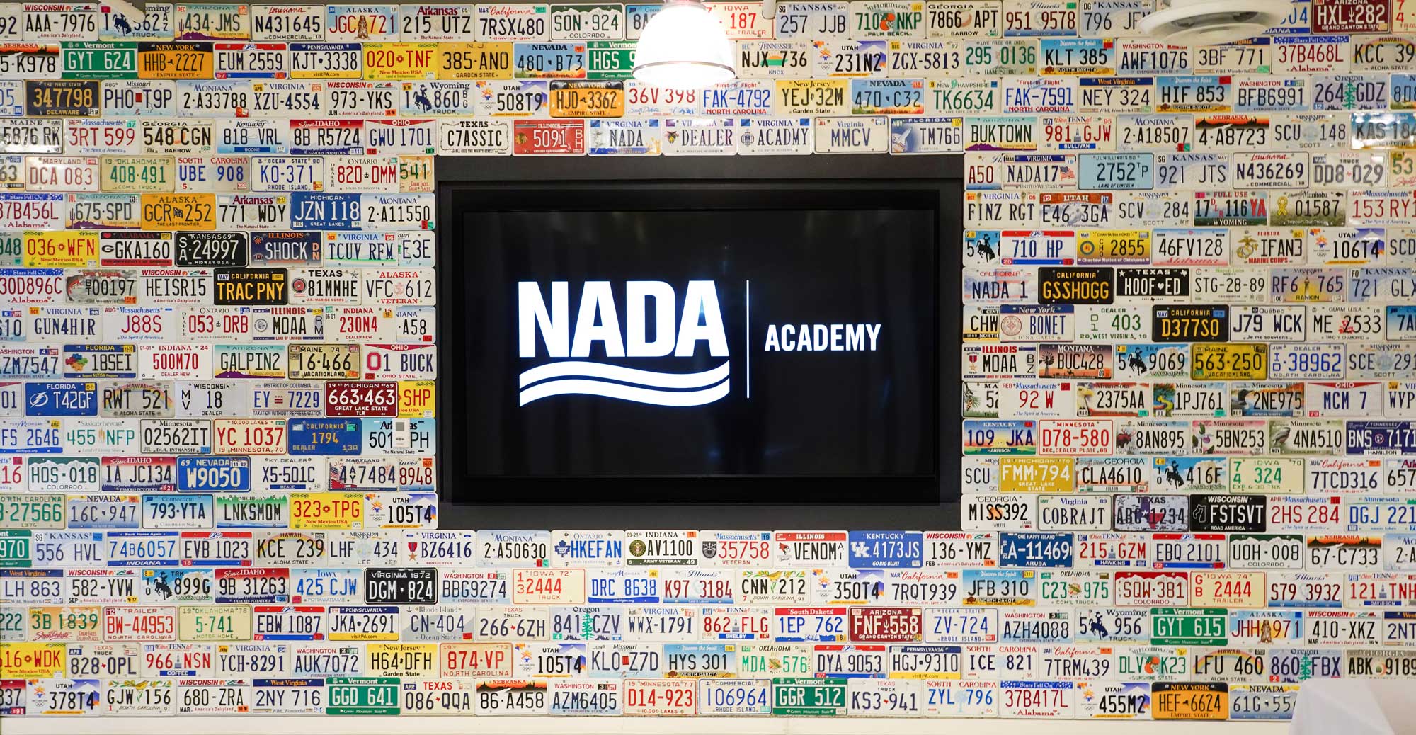 NADA Academy license plate wall