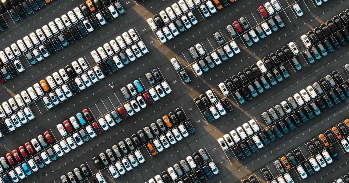 aerial view of cars on lot 